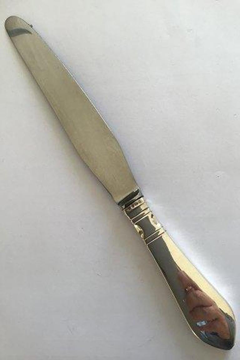Georg Jensen sterling silver continental dinner knife no 003.

Measures 24.7 cm(9 23/32 in).
  