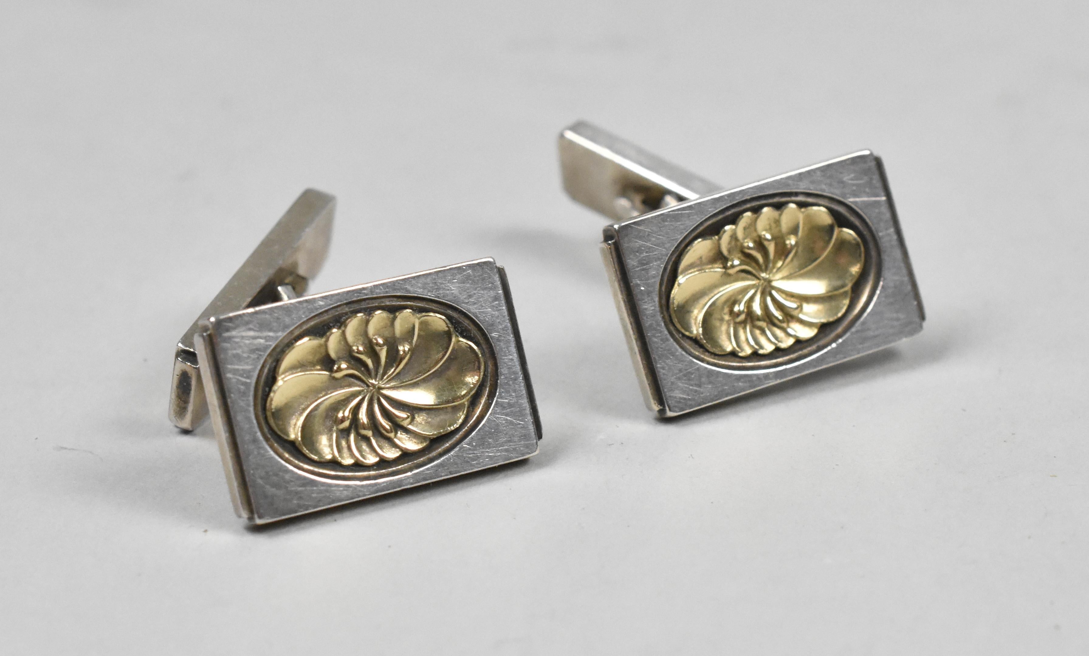 Sterling silver cufflinks circa 1955 by Georg Jensen designed by Henry Pilstrup. Stylized floral detail.