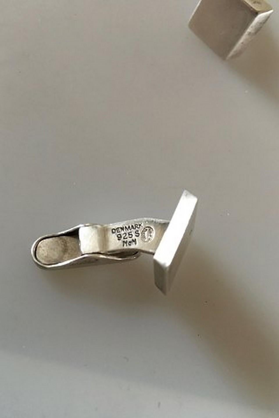 Georg Jensen Sterling Silver Cuff Links. From after 1945. Also marked with Hans Hansen. Measures 1.5 cm / 0 19/32 in. x 1.5 cm / 0 19/32 in.
Weighs 20 g.