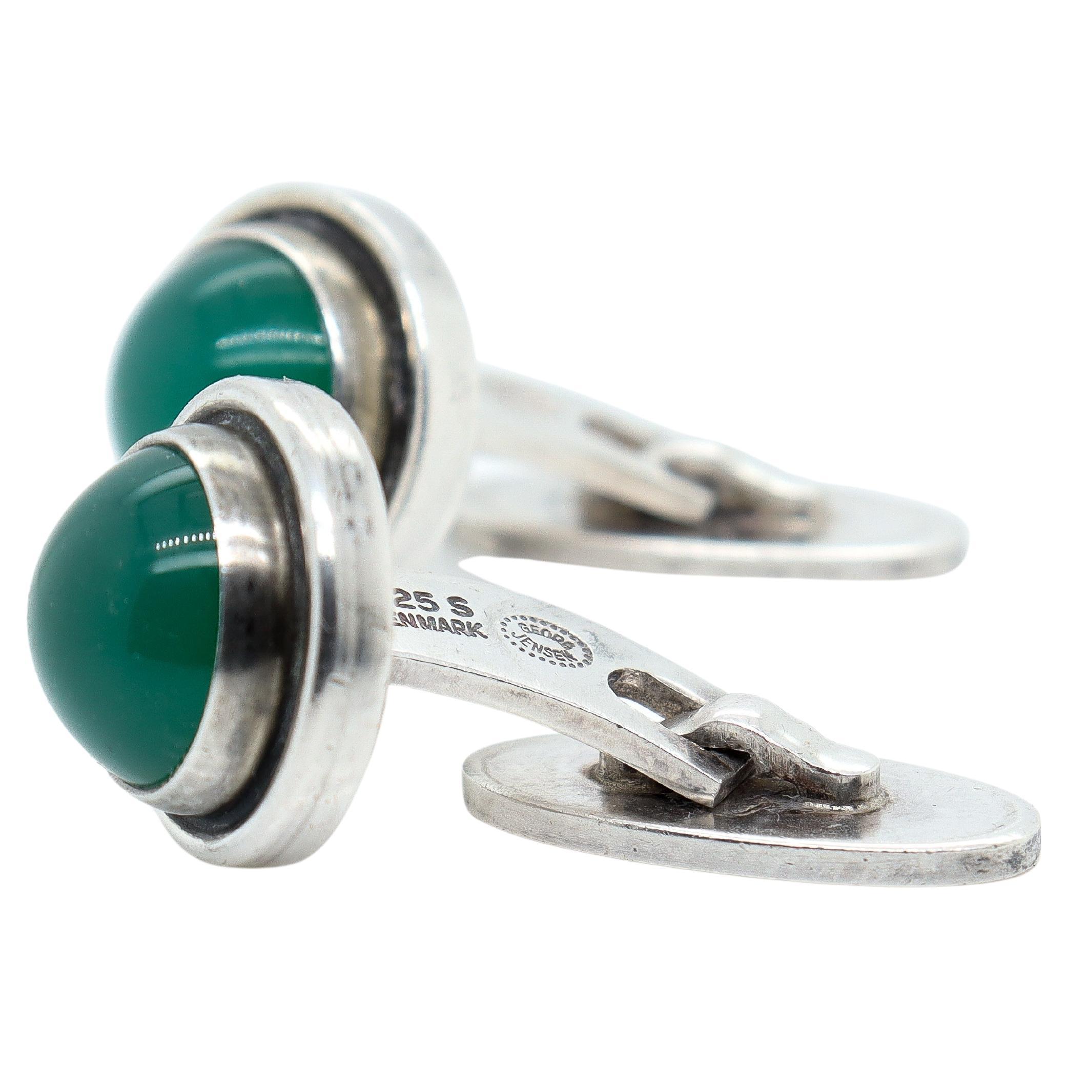 A pair of fine vintage Georg Jensen cufflinks.

In sterling silver with chrysoprase cabochons

Designed by Harald Nielsen for Georg Jensen

Pattern no. 44D.

Marked to one side of the post with 925 S / Denmark / post-1945 Georg Jensen's maker's