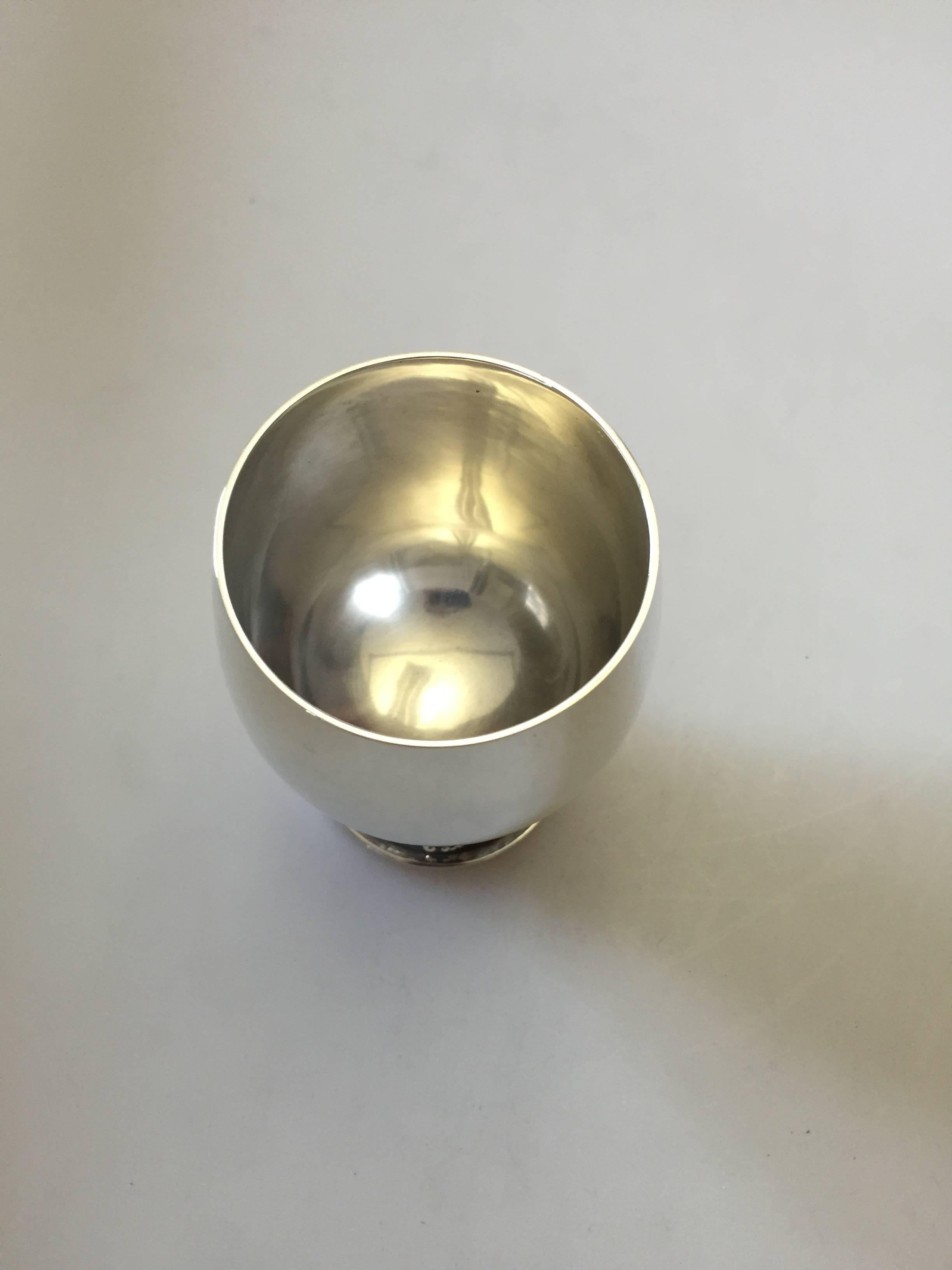 Georg Jensen sterling silver grape cup no. 296A. Measures: 10 cm x 7 cm. The cup is in good conduction all around.

Georg Jensen (1866-1935) opened his small silver atelier in Copenhagen, Denmark in 1904. By 1935 the year of his death, he had