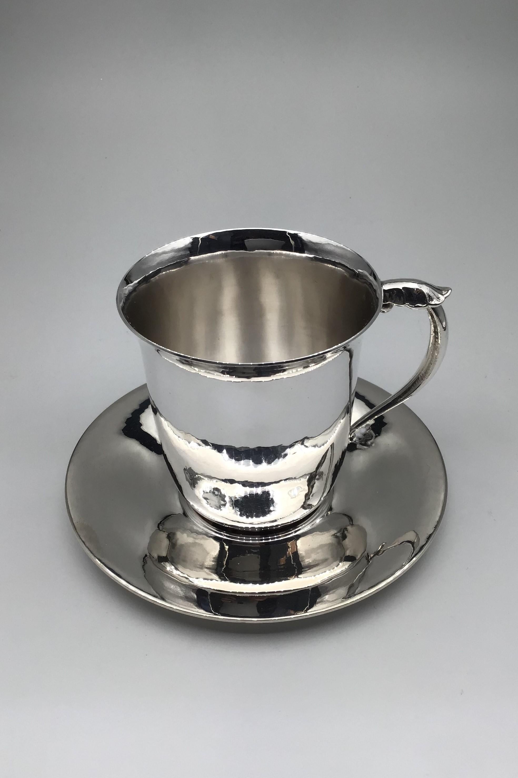
Georg Jensen Sterling Silver Cup/saucer No 444B/444

Cup Measures Diam 7 cm (2.75 inch) H 7.2 cm (2.83 inch) Weight 107.6 gr/ 3.80 oz. Post 1945
Saucer Measures Diam 11.7cm (4.6 inch) Weight 74 gram / 2.45 oz. 1933-1944