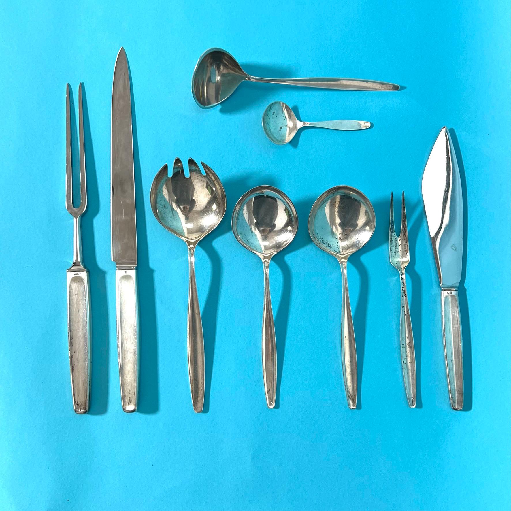 Modernist sterling silver flatware set in the Cypress pattern, designed by Tias Eckhoff for Georg Jensen, Denmark, circa early 1950s. We have a full service for 12: each six-piece place setting consists of a dinner knife, butter knife, dinner and
