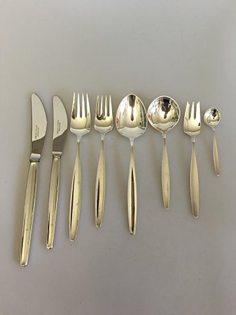 Georg Jensen Sterling Silver 'Cypress' Flatware Set of 48 pieces for six persons. 

Six dinner knifes with cut blade 22.4 cm l (8 13/16 in)
Six dinner forks 19 cm l (7 31/64 in)
Six lunch knifes 20 cm l (7 7/8 in)
Six lunch forks 17 cm l (6