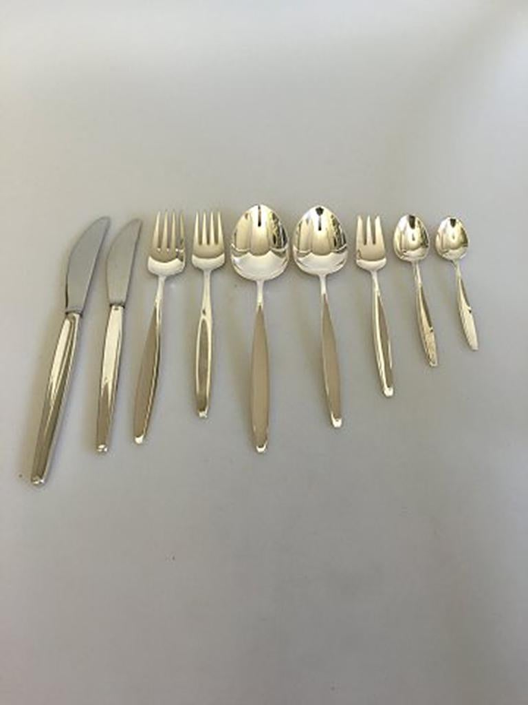 Georg Jensen sterling silver cypress set of 108 pieces for 12 person. 

12 x Dinner knifes 22.4 cm l (8 13/16 in)
12 x Dinner forks 19 cm l (7 31/64 in)
12 x Dinner spoons 20 cm l (7 7/8 in)
12 x Lunch knifes 20 cm l (7 7/8 in)
12 x Lunch