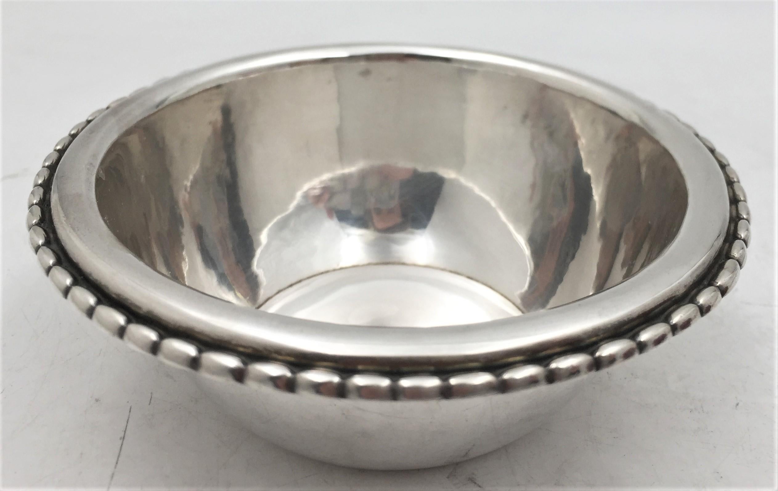 Georg Jensen, sterling silver, hand hammered dish or bowl, made between 1925 and 1932, in Rope pattern number 290. It measures 5'' in diameter by 1 3/4'' in height and bears early hallmarks as well as an inscription as shown. 

Danish silversmith