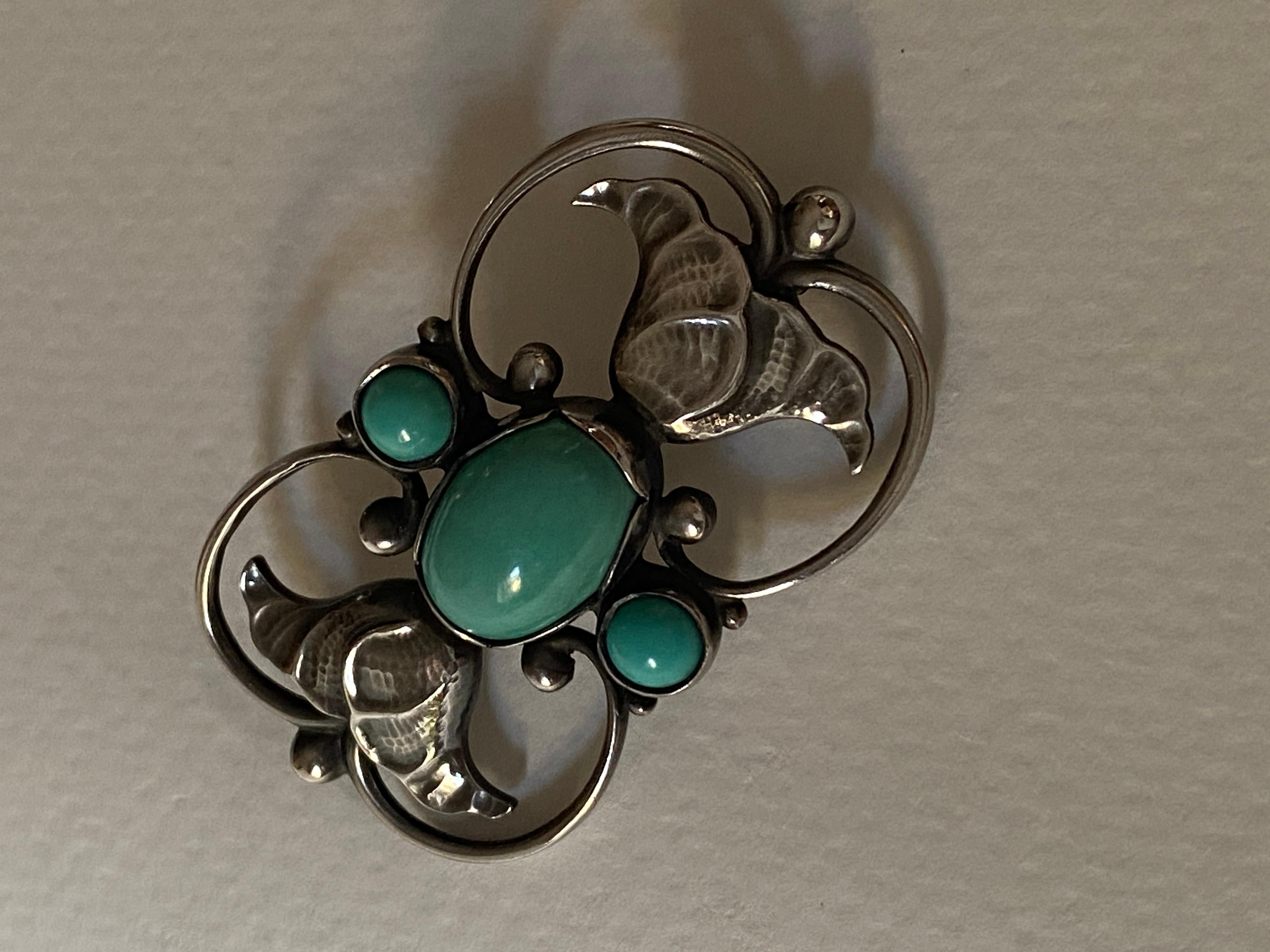 Georg Jensen Sterling Silver “Double-Tulip” Brooch with Turquoise, Design #236A
 


 A similar example can be found on p. 138 in the book, 