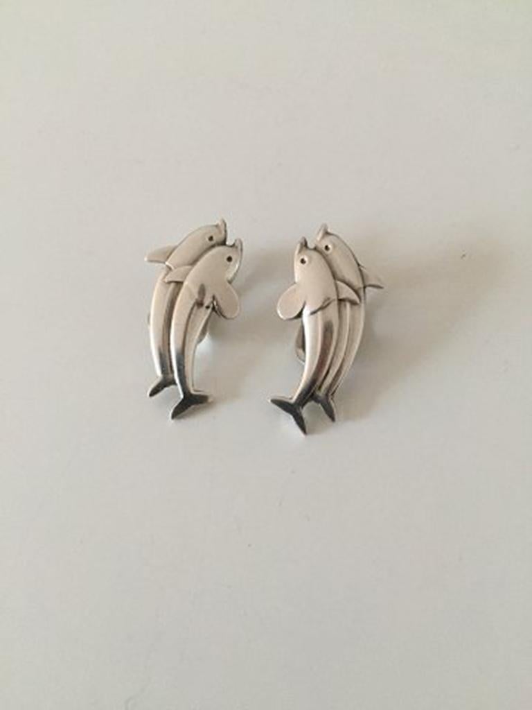 Georg Jensen Sterling Silver Earclips with Dolphins No 129. In good condition and measures 3 cm / 1 3/16 in. Weighs 9 g / 0.30 oz.