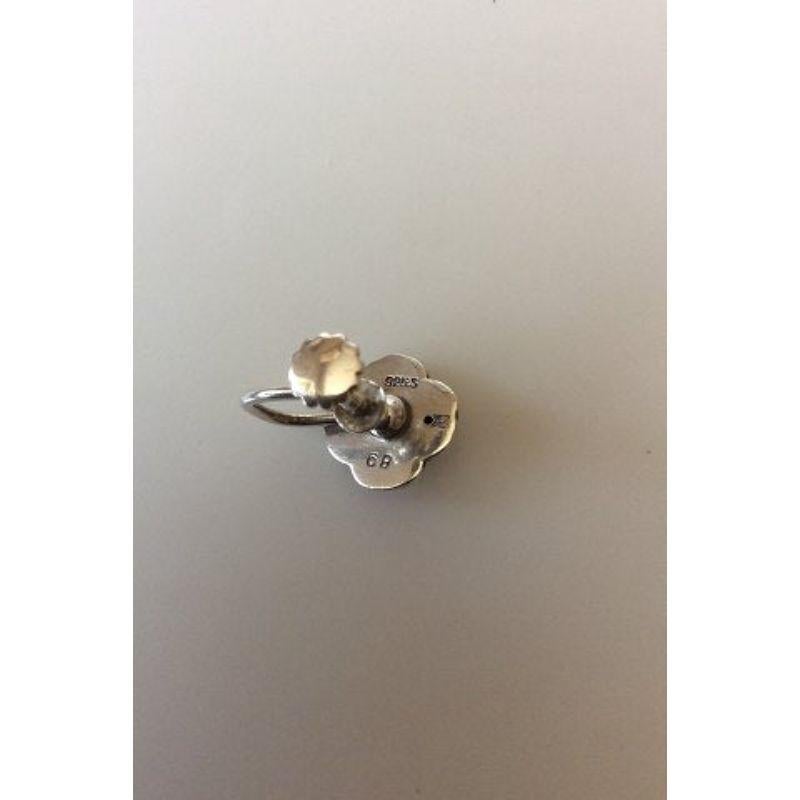 Georg Jensen Sterling Silver Flower Earscrews No 68. 

Measures 0.8 cm / 0 5/16 in. diameter. Weighs 3.8 g / 0.13 oz.