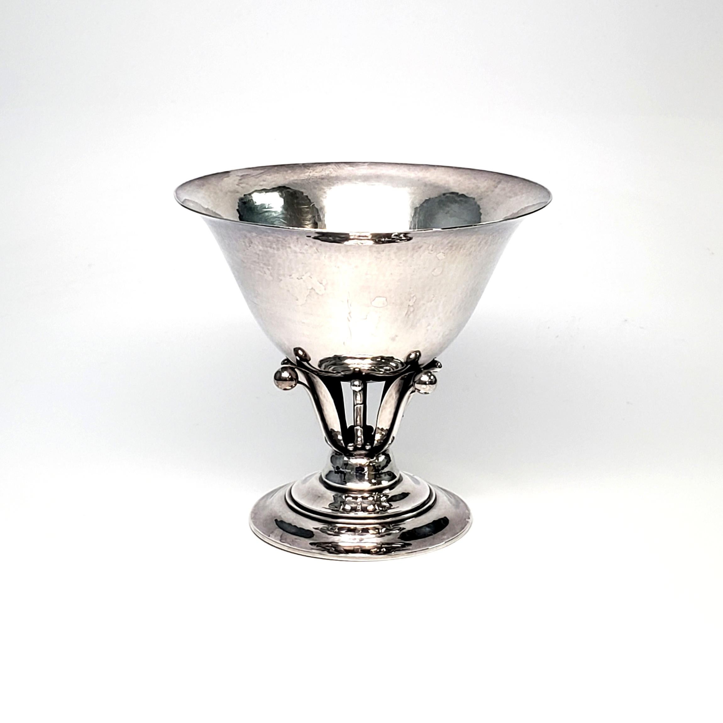 Vintage Georg Jensen sterling silver footed bowl #17B, circa 1930s.

Designed by Johan Rohde, the piece features a lightly hammered bowl held atop a floral pedestal on a stepped circular foot. The beaded oval hallmark dates the piece, circa