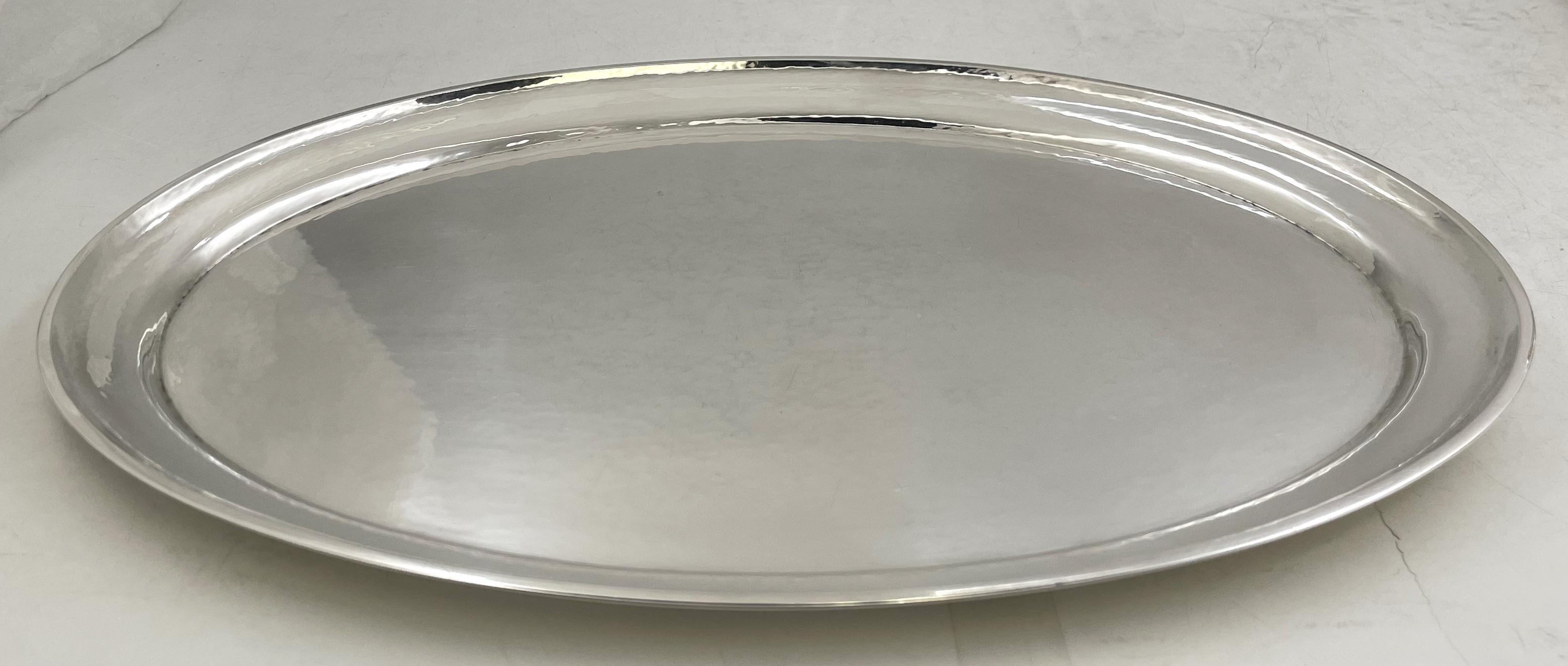 Georg Jensen sterling silver platter tray in Continental pattern number 223C, beautifully hand-hammered and in an elegant, geometric design. It measures 13 1/2'' in length by 9 3/4'' in width by 2/3'' in height, weighs 22 troy ounces, and bears