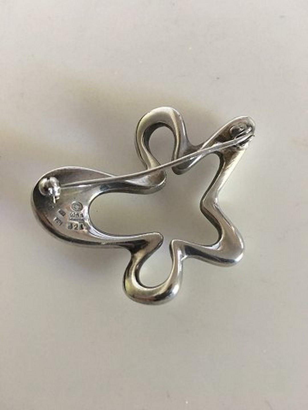 Georg Jensen Sterling Silver Henning Koppel Splash Brooch No 321. Measures 4.6 cm / 1 13/16 in. Weighs 19 g / 0.55 oz. Vintage with Dutch import marks