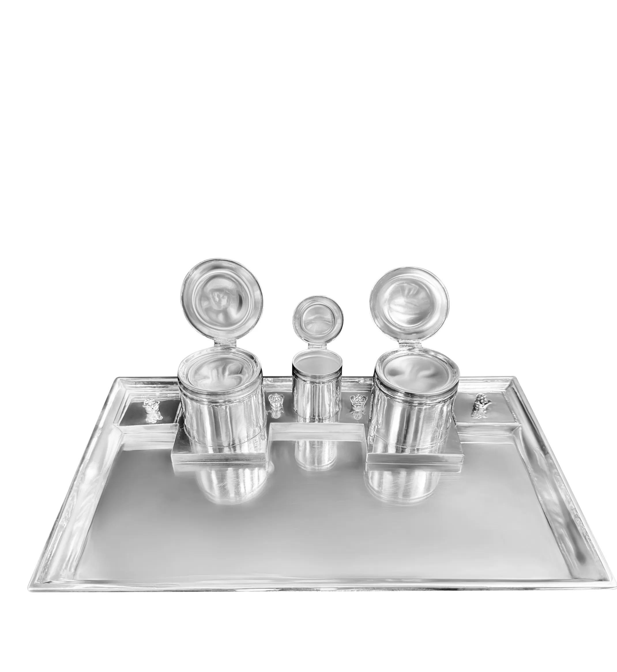 A rare early and large Georg Jensen sterling silver Inkstand, design #272 by Johan Rohde in 1918.

This exceptional piece features a rectangular raised base with a hand-chased scroll edge border of Nordic design. The set includes a pair of matching