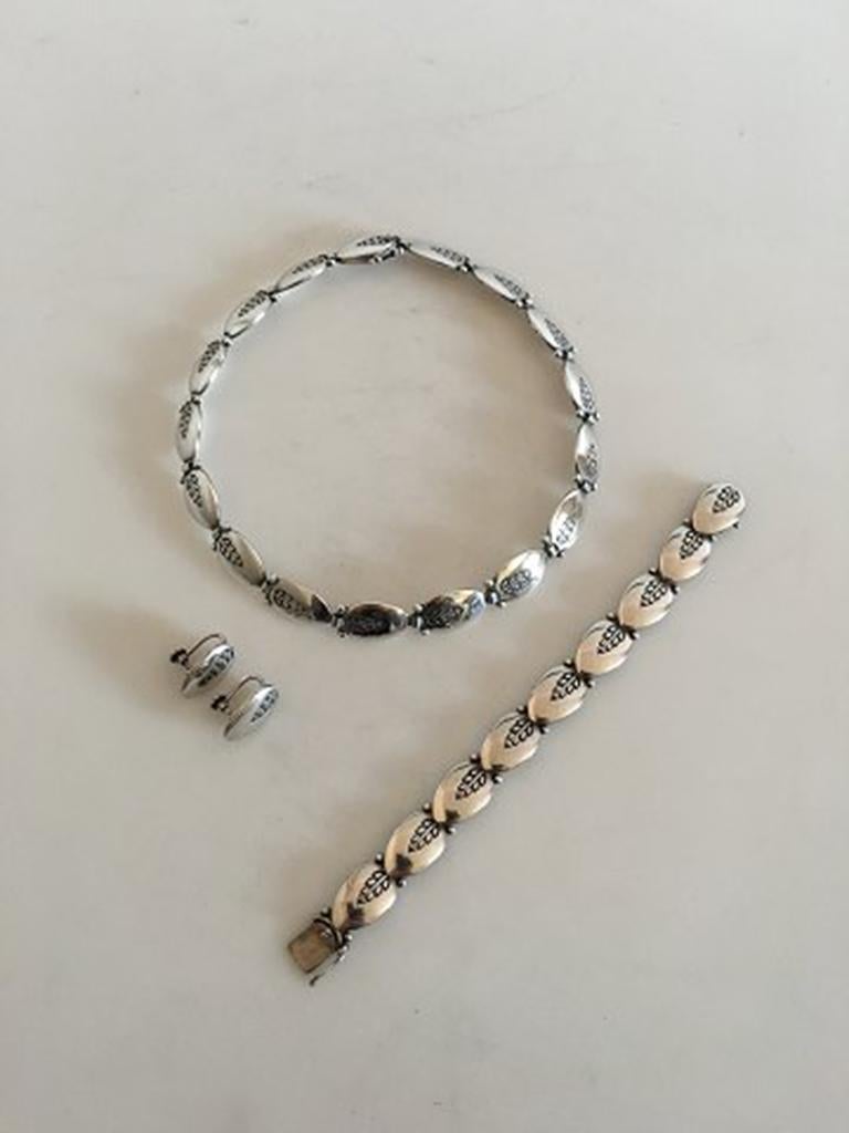 Georg Jensen Sterling Silver Jewelry Set #94. Necklace #94B 36 cm L. (14 11/64 in). Weighs 57 g.. Bracelet #94A 16 cm (6 19/64 in). Ear Screws #113 weighs 8 g. The Set is from after 1945.