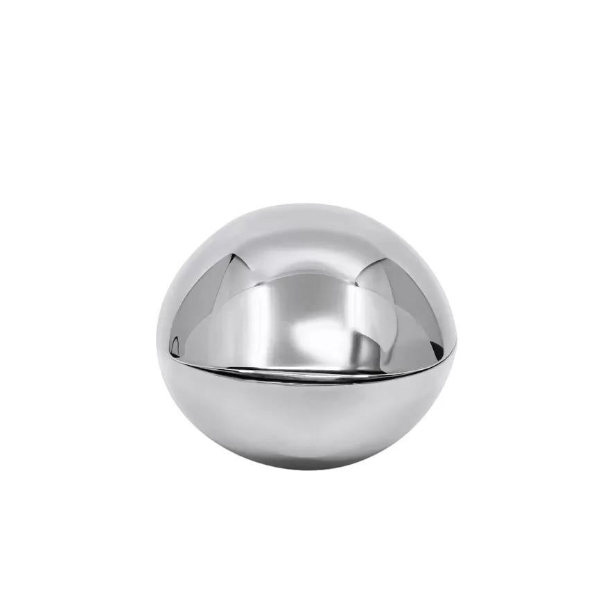 A vintage Mid-Century sterling silver bonbonniere designed by Henning Koppel for Georg Jensen in 1963. This exquisite two-piece organic form bonbon resembles the shape of an oyster or clam, inspired by Koppel's surroundings at his home in Taarbek,