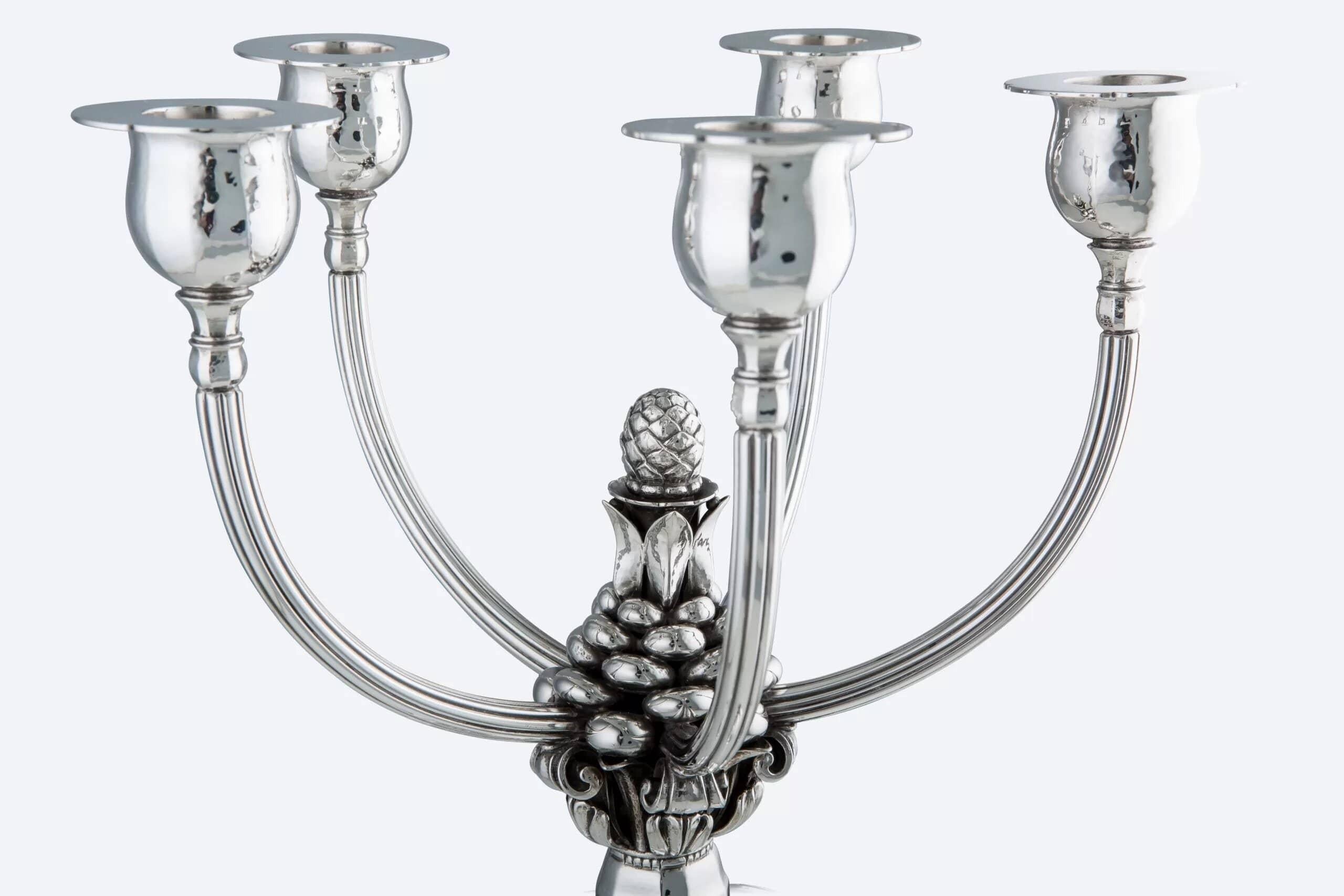A pair of extra-large Georg Jensen sterling silver candelabra, design #474 by Johan Rohde. This design features many of the same elements as Rohde's iconic acorn silverware pattern and was created to complement that style. Each candelabrum stands on