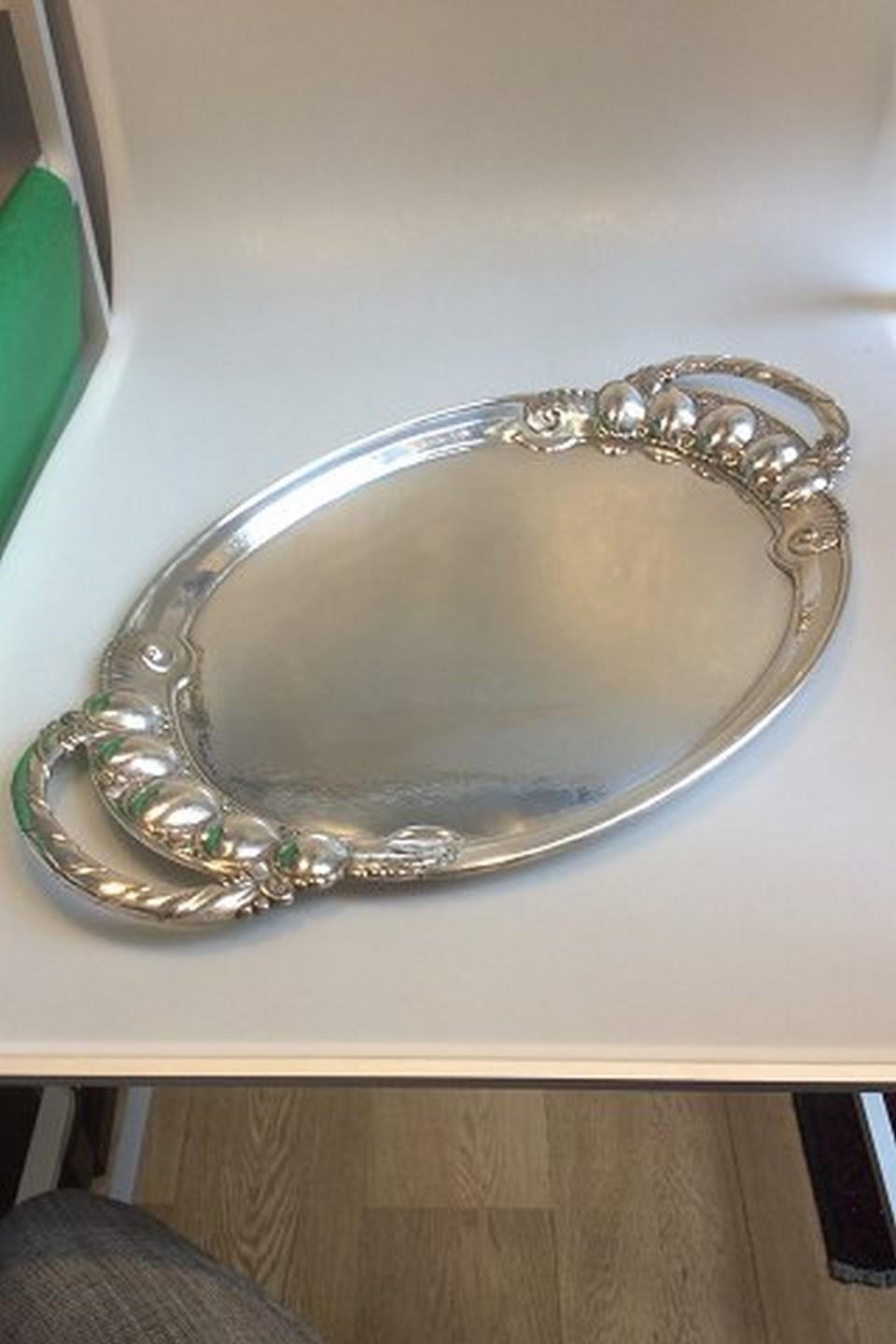 Georg Jensen sterling silver large serving tray in the melon pattern no. 159B.

Measures: 66cm (26in) long
Weight is 3132g (100.7 oz).

In perfect condition.
Item no.: 341826.