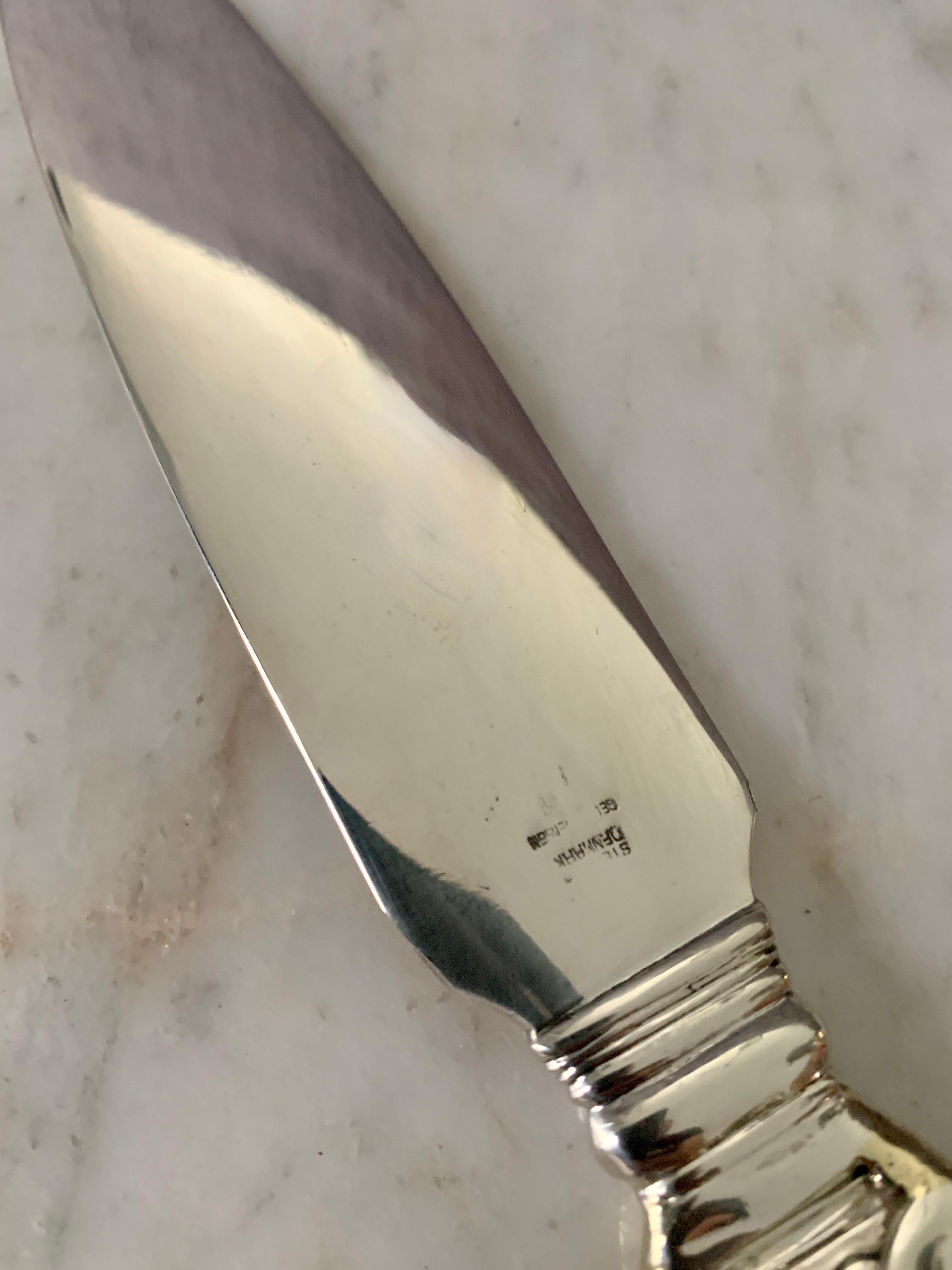 A stunning and quite large Georg Jensen Denmark Letter opener. 

The piece has a lovely handle. While there has been some repair the piece is in sturdy an newly polished condition. The opener is very large at 10 inches long - a wonderful practical