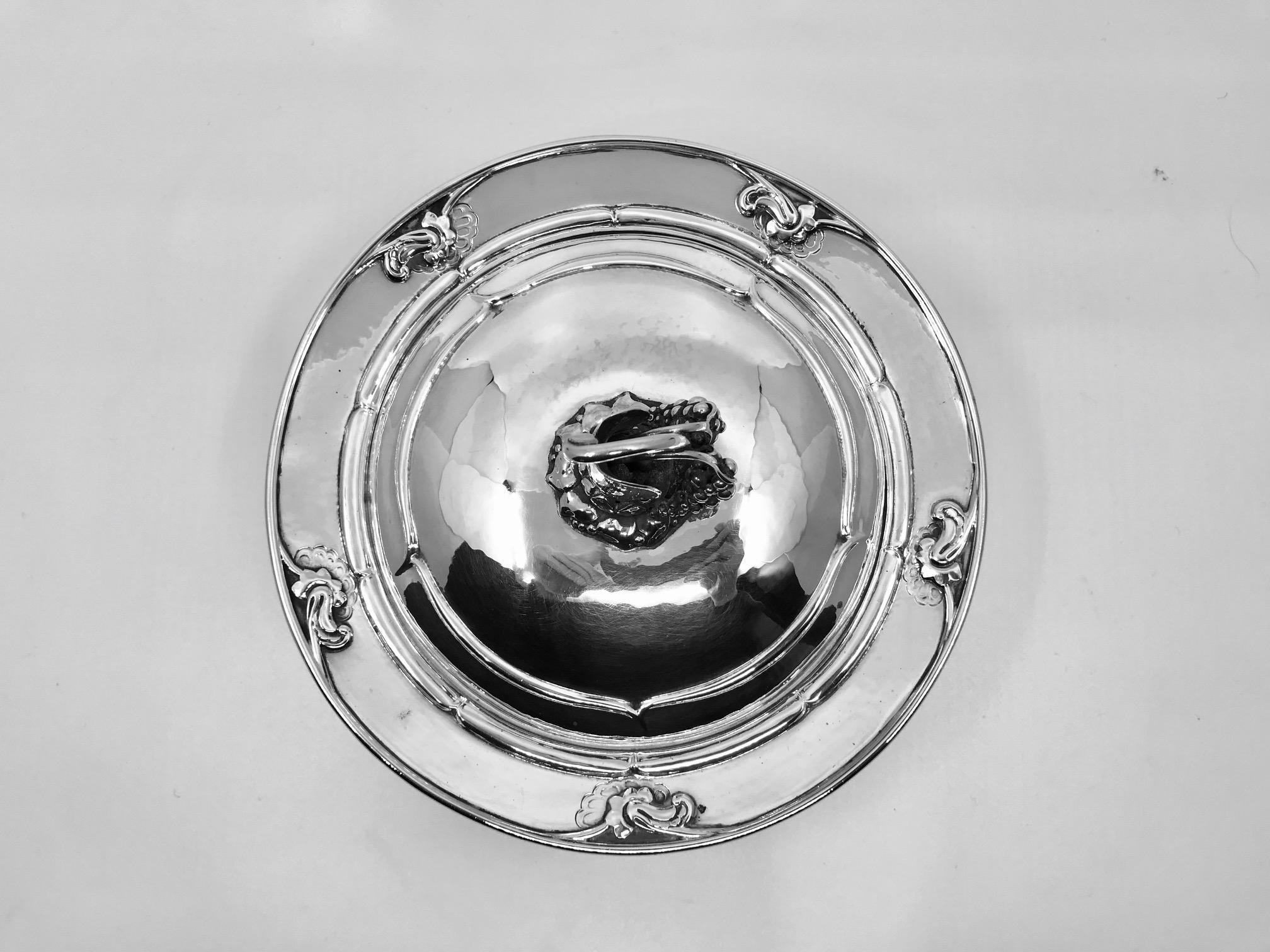 Grape design Georg Jensen sterling silver lidded dish with five floral motifs, design #228B by Georg Jensen from circa 1917. A wonderfully functional piece that can also be used as a decorative piece.

Measures: 4 3/4