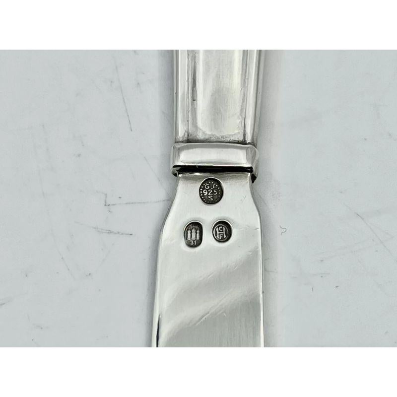 A sterling silver Georg Jensen butter knife, item #046 in the Lily of the Valley pattern, design #1 by Georg Jensen from 1913.

Additional information:
Material: Sterling silver
Styles: Art Nouveau
Hallmarks: Hallmarks: With Georg Jensen hallmark,