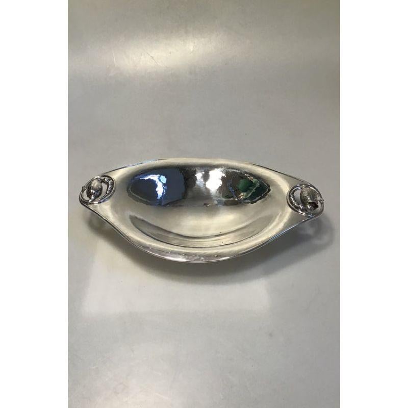 Georg Jensen Sterling Silver Magnolia No 2 bread tray 

Measures 30 cm x 20 cm (11 13/16 in x 7 7/8 in) Weight 593 gr / 20.90 oz (S10 = 1992).