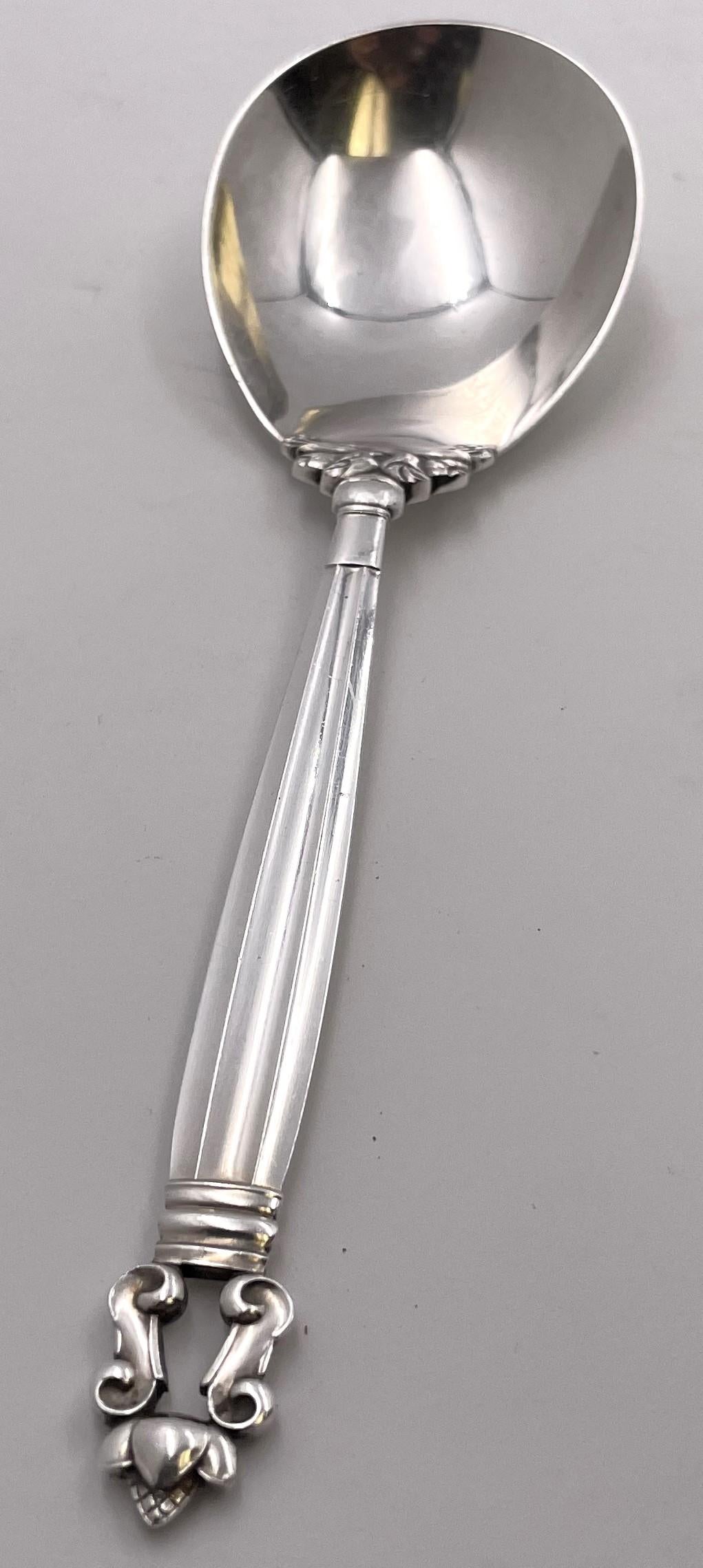 Georg Jensen sterling silver mashed potato spoon in the celebrated Acorn pattern. It measures 9'' in length and bears hallmarks as shown.

Danish silversmith Georg Jensen (1866-1935) set up his own silver business in 1904 in Copenhagen. Jensen's
