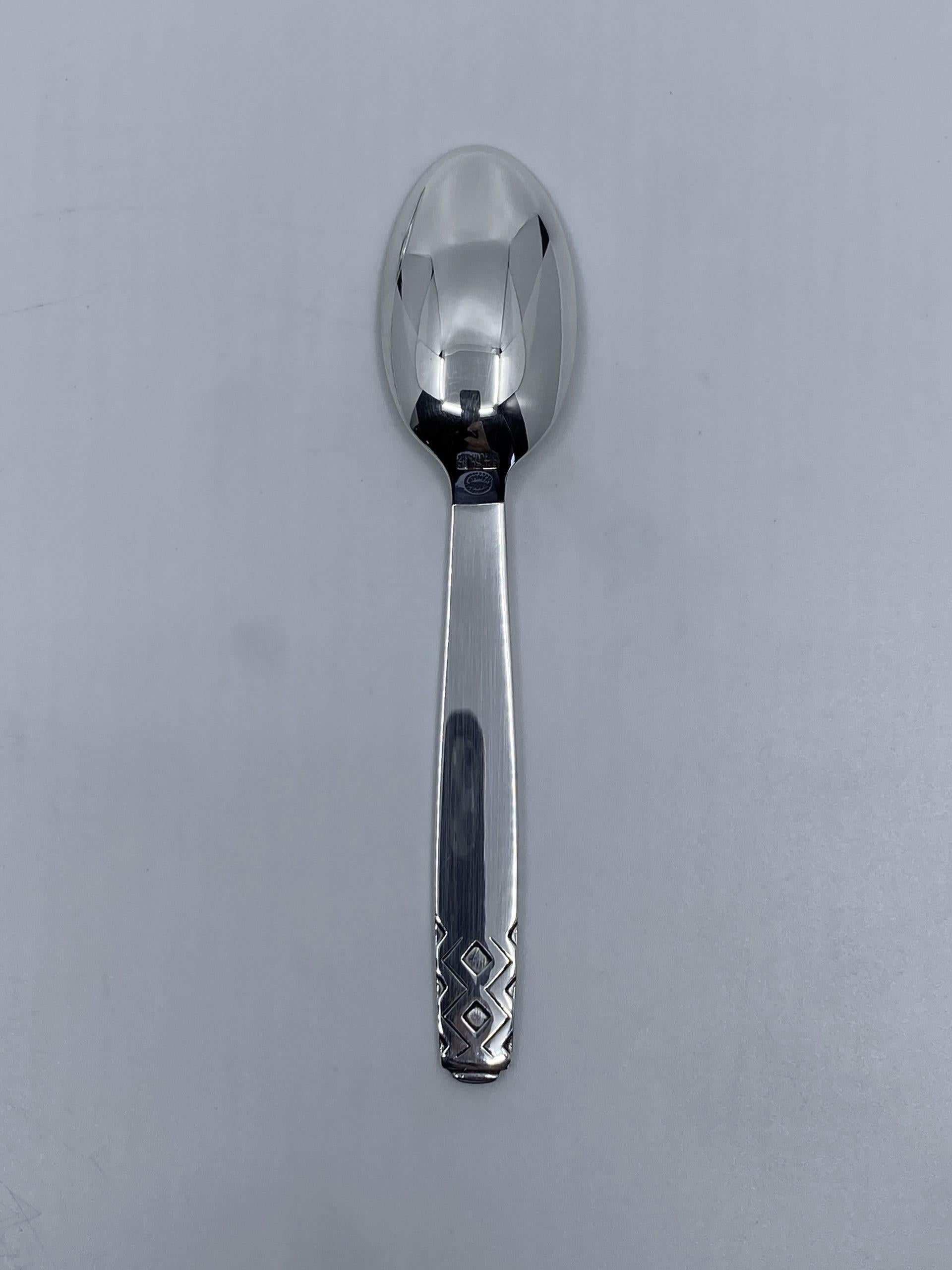 Sterling silver Georg Jensen small teaspoon, item 033 in the Mayan Pattern, design #56 by Johan Rohde from 1937.

Additional information:
Material: Sterling silver
Styles: Art Deco
Hallmarks: With Georg Jensen hallmark, made in Denmark.
Dimensions: 