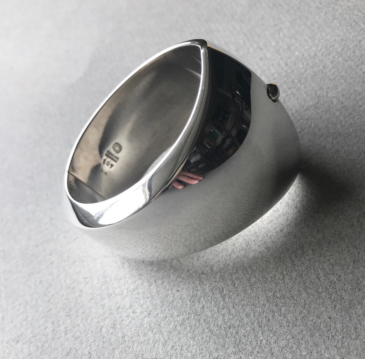 Georg Jensen Sterling Silver Modernist Cuff by Nanna Ditzel, No. 107.
Georg Jensen Sterling Silver Earrings No. 92
This iconic modernist design is a true statement piece and very comfortable to wear.  
Dimensions: 2.25