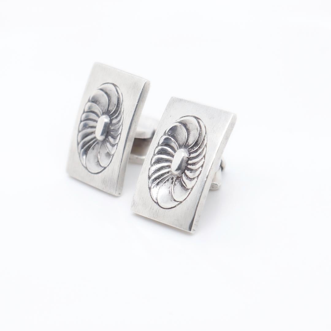 A pair of fine Georg Jensen cufflinks.

In sterling silver.

Designed by Henry Pilstrup for Georg Jensen. 

Marked to one side of the post with Georg Jensen / Sterling / Denmark and to the other side of the post with 59B.

Simply a wonderful pair of