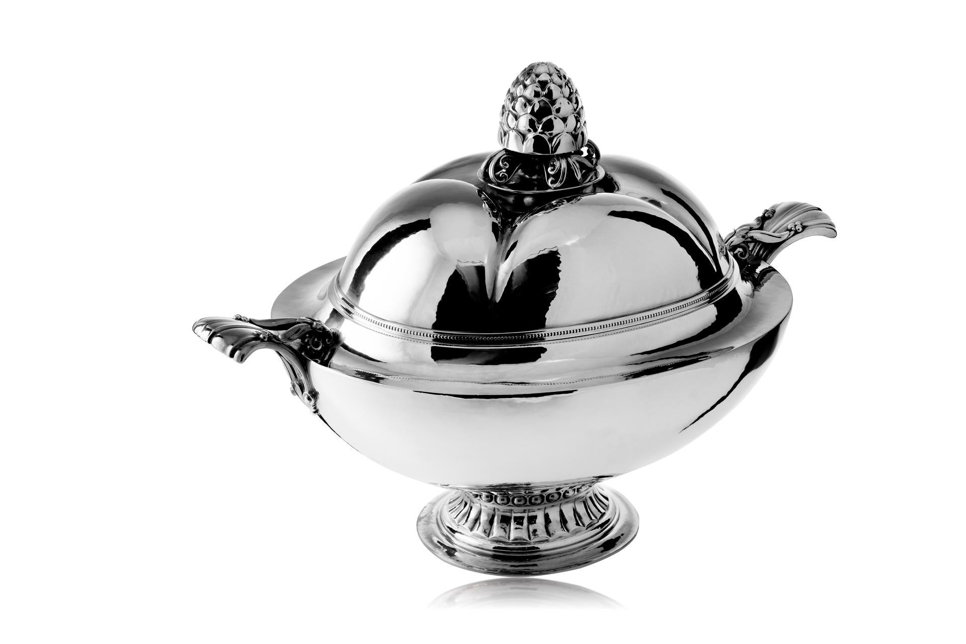 An Exquisite and Exceptionally Rare Georg Jensen Silver Centerpiece Tureen and Lid, Model 573, thoughtfully crafted by the visionary Georg Jensen in 1926. This remarkable creation stands as a testament to the unparalleled craftsmanship and artistic