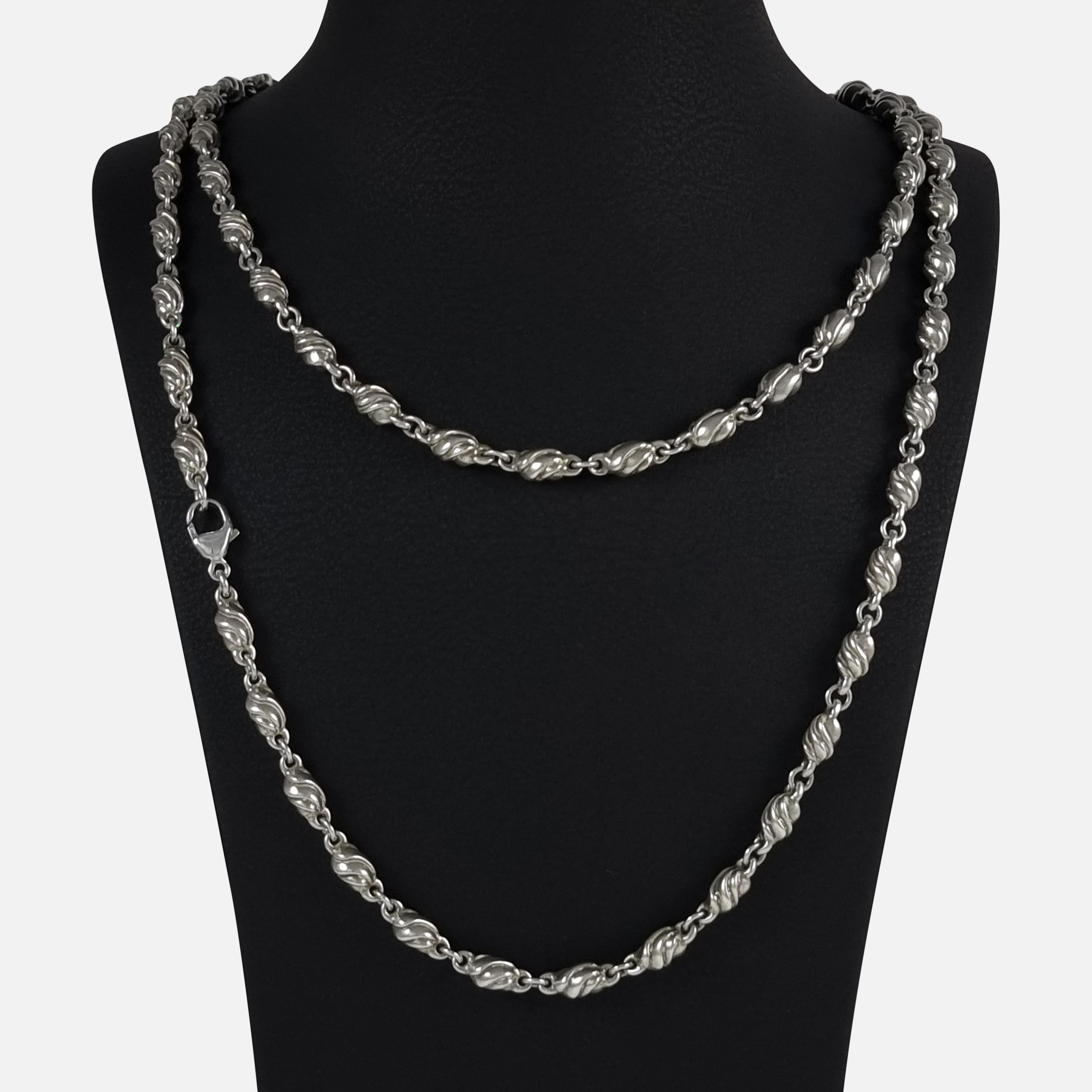 A Danish sterling silver necklace, #383, by Georg Jensen. 

The necklace is stamped with the Georg Jensen within a dotted oval marking (used since 1945), 