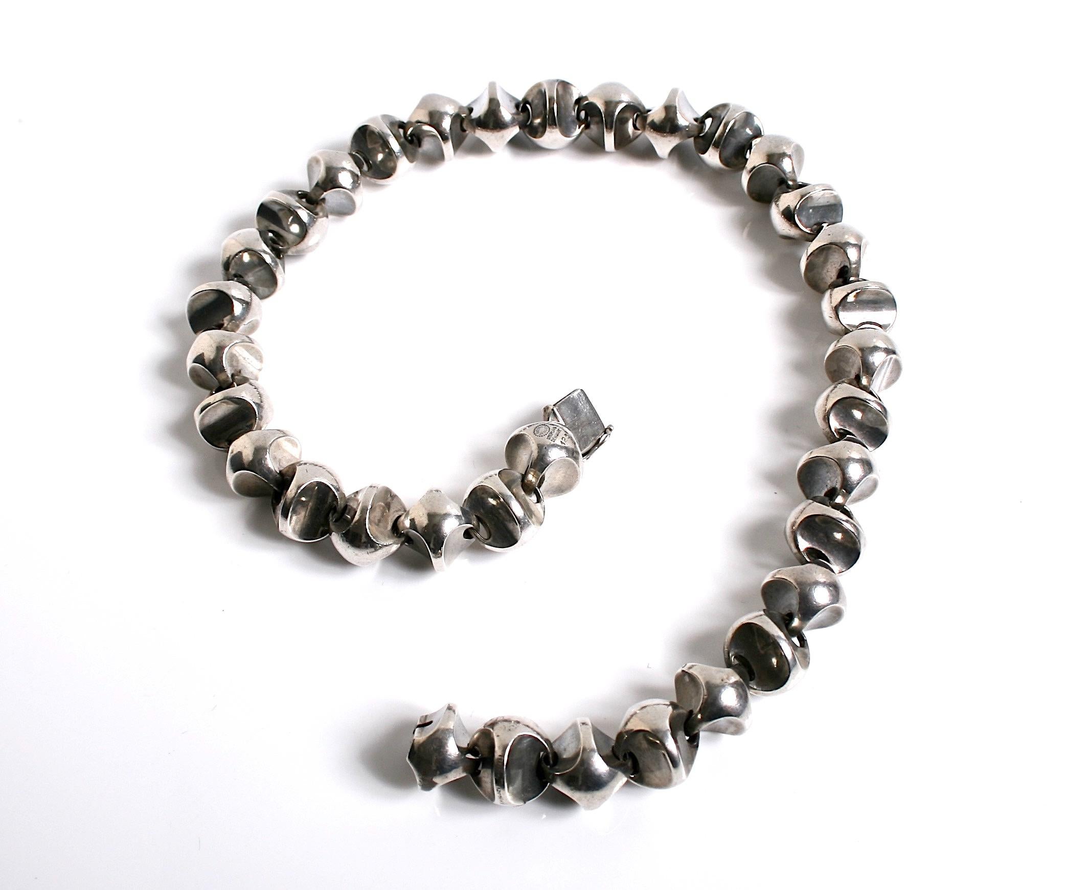 Extremely Rare sterling silver cast necklace designed by Flemming Eskildsen for Georg Jensen Denmark c.1961 design number 125. Very early sought after necklace matching bracelet available. Comes in a Georg Jensen box Markings: post 1945 stamps