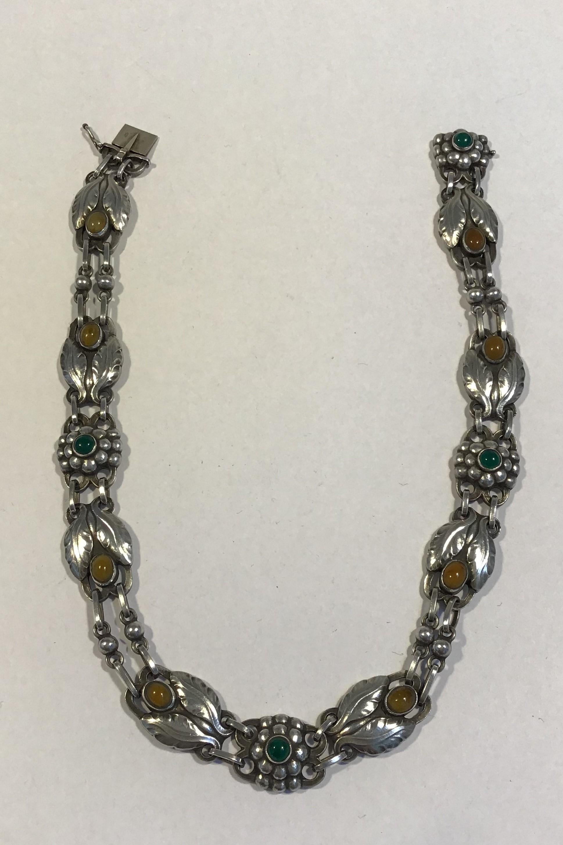 Georg Jensen Sterling Silver Necklace No 1 Amber&Chrysoprase (1915-1927)

Measures L 37 cm (14.56 in)
Weight 45.7 gr/1.61 oz 
(English Hallmarks)