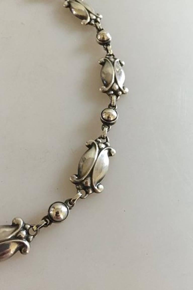 Georg Jensen Sterling Silver Necklace No 15 with Silver Stones

Measures 42 cm L and 1.4 cm W. / 16 17/32 in. x 0 35/64 in.