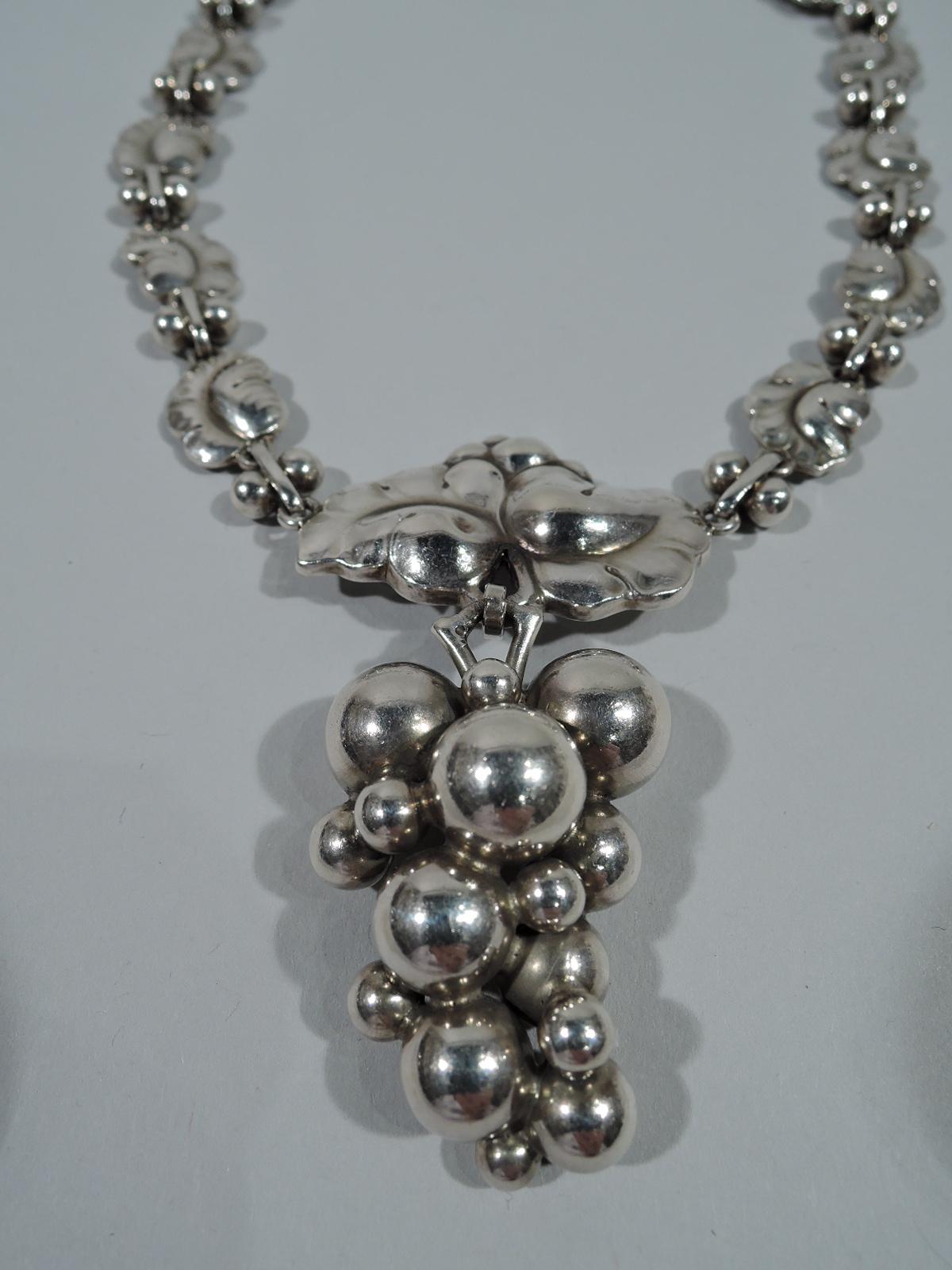 Beautiful sterling silver necklace. Made by Georg Jensen in Copenhagen. Chain comprises leaves joined by links with double balls. Large central leaf with pendant grape bunch – a classic Jensen motif. Postwar hallmark includes no. 96.  