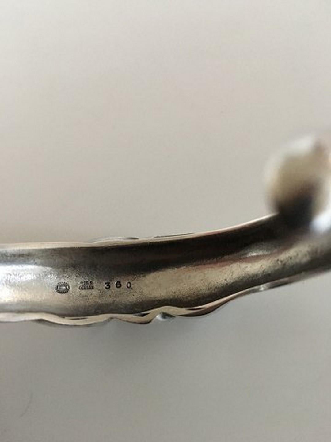 Georg Jensen Sterling Silver Ole Kortzau Cuff/ Armring No. 360 with Moonstone. Measures 1.6 cm at its widest point. 5.4 cm inner diameter (2 1/8