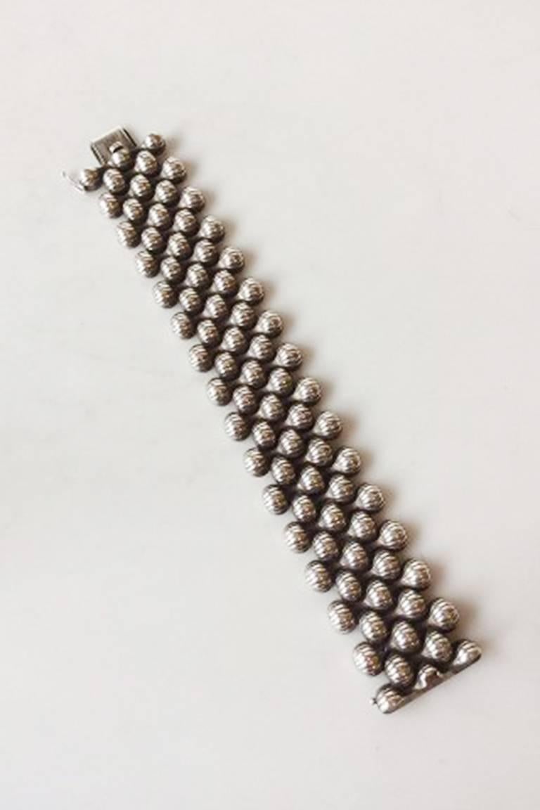 Georg Jensen Sterling Silver Onion Pattern Bracelet by Arno Malinowski No 110. Measures 18.6 cm / 7 21/64 in. long and 3.1 cm / 1 7/32 in. wide. Weighs 101 grams / 3.55 oz.