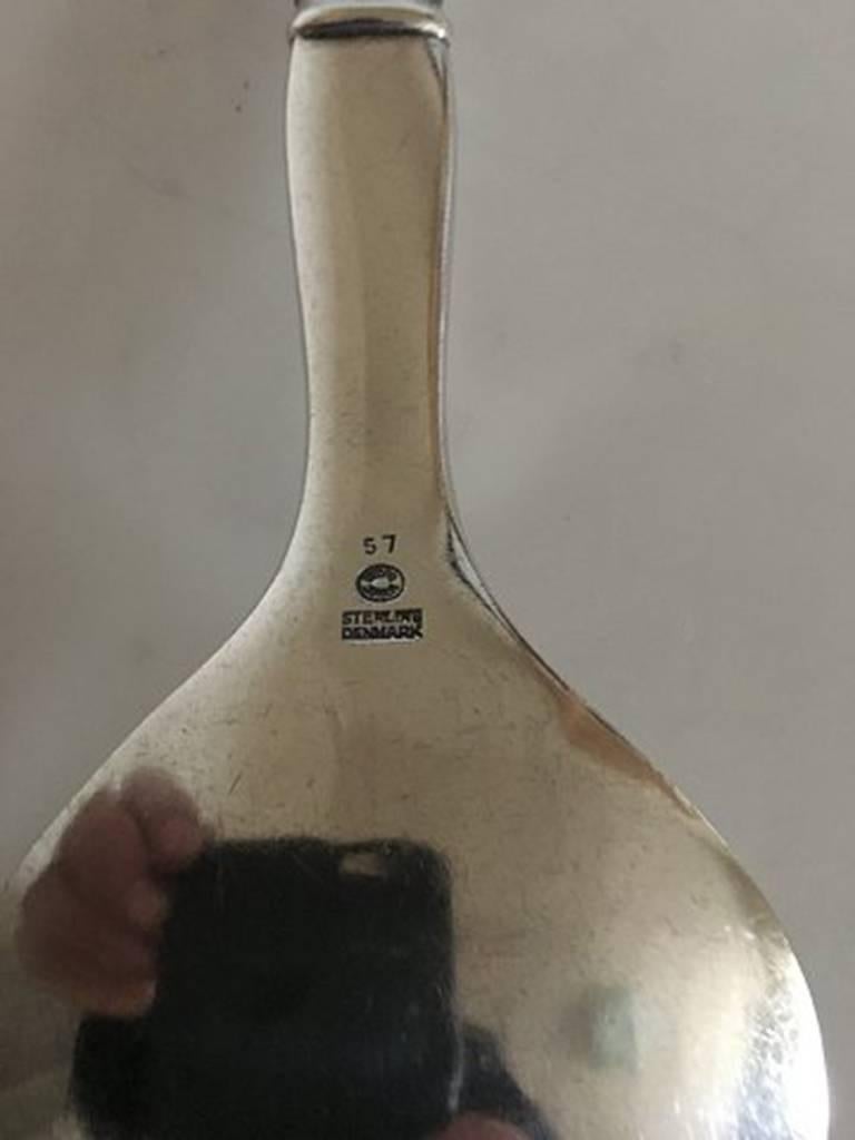 Georg Jensen sterling silver ornamental serving fork no. 57. Measures: 22 cm L (8 21/32 in.). From after 1945.