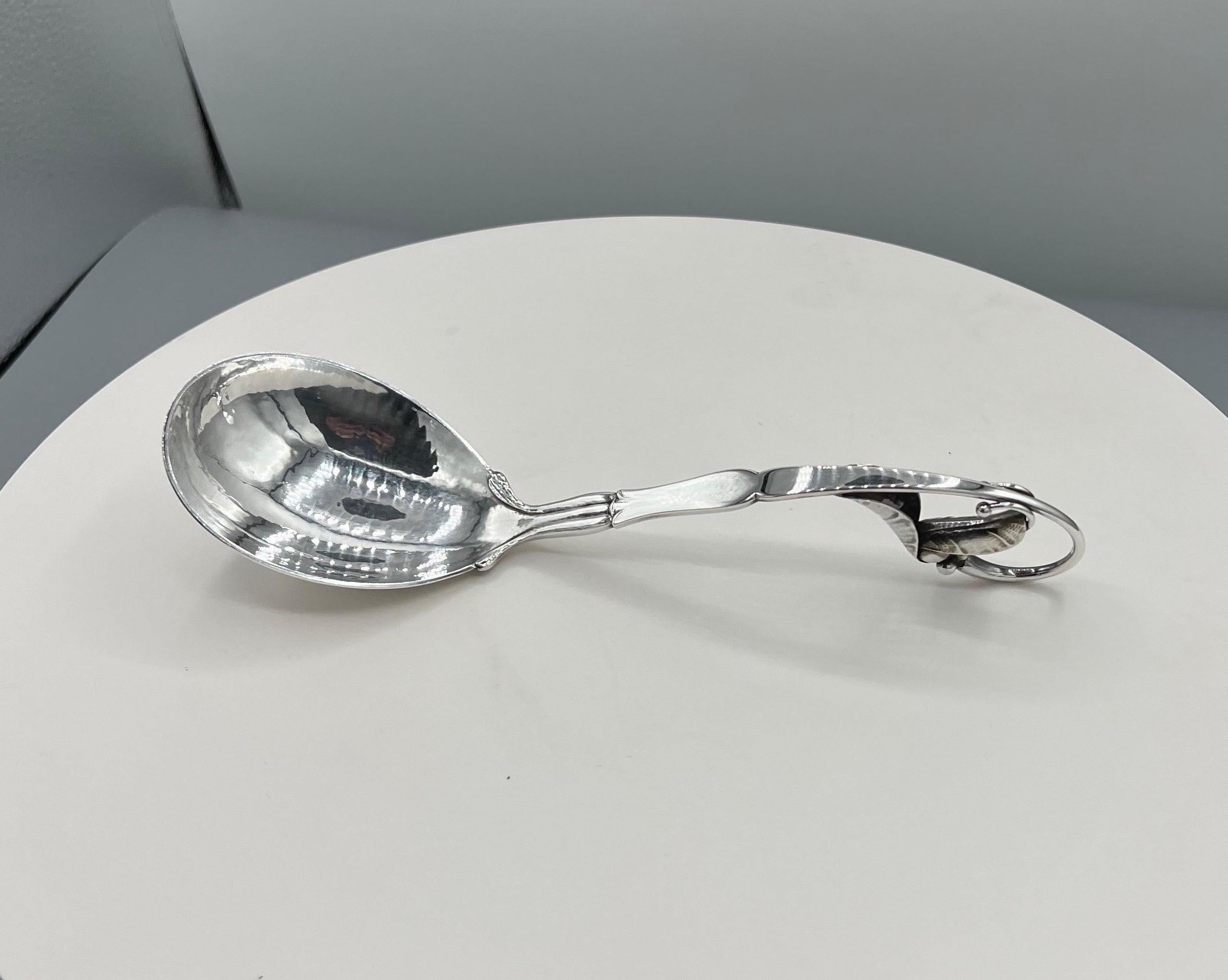 Georg Jensen Sterling Silver Serving Spoon 
For over a century, Georg Jensen has produced some of the finest objects in Scandinavian modern design, including silver tableware, serving pieces, home decor, jewelry and more, frequently partnering with