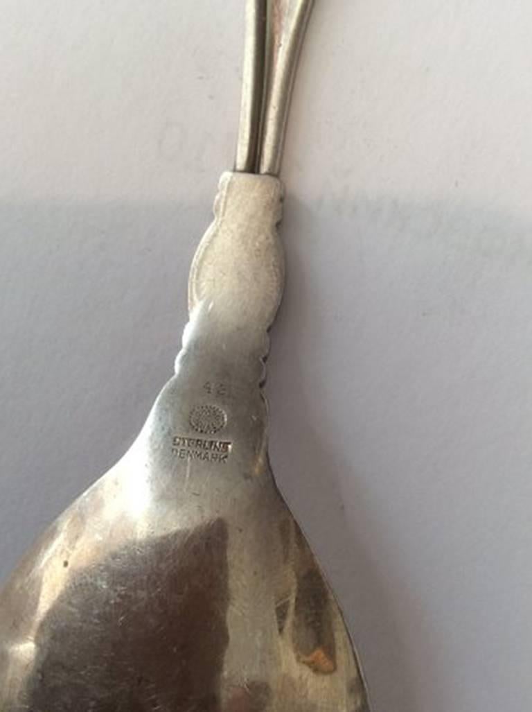 Georg Jensen sterling silver ornamental serving spoon #42. Measures: 15.3 cm / 6 1/32 in.