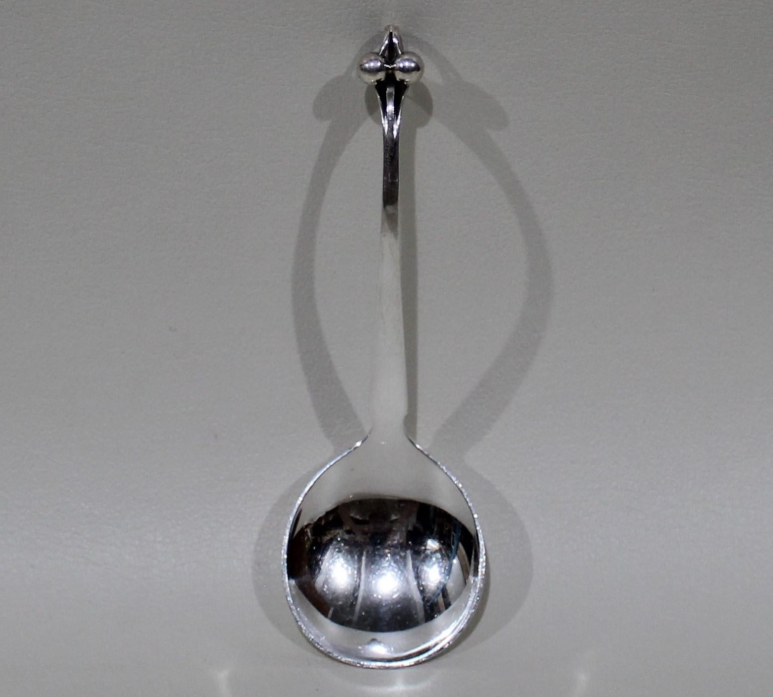 Georg Jensen sterling silver ornamental serving spoon, model 97. 

