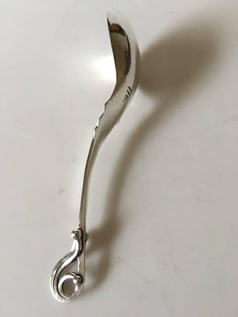Georg Jensen sterling silver ornamental serving spoon No. 49. Measures: 19 cm L (7 31/64 in.).