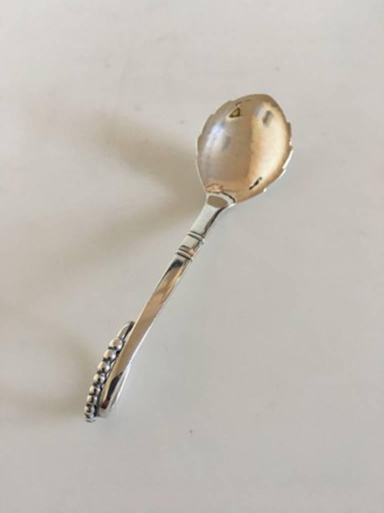 Georg Jensen sterling silver ornamental spoon #41. With Georg Jensen silver marks from after 1945 and one with 1933-1933. Measures: 12 cm L (4 23/32 in.)