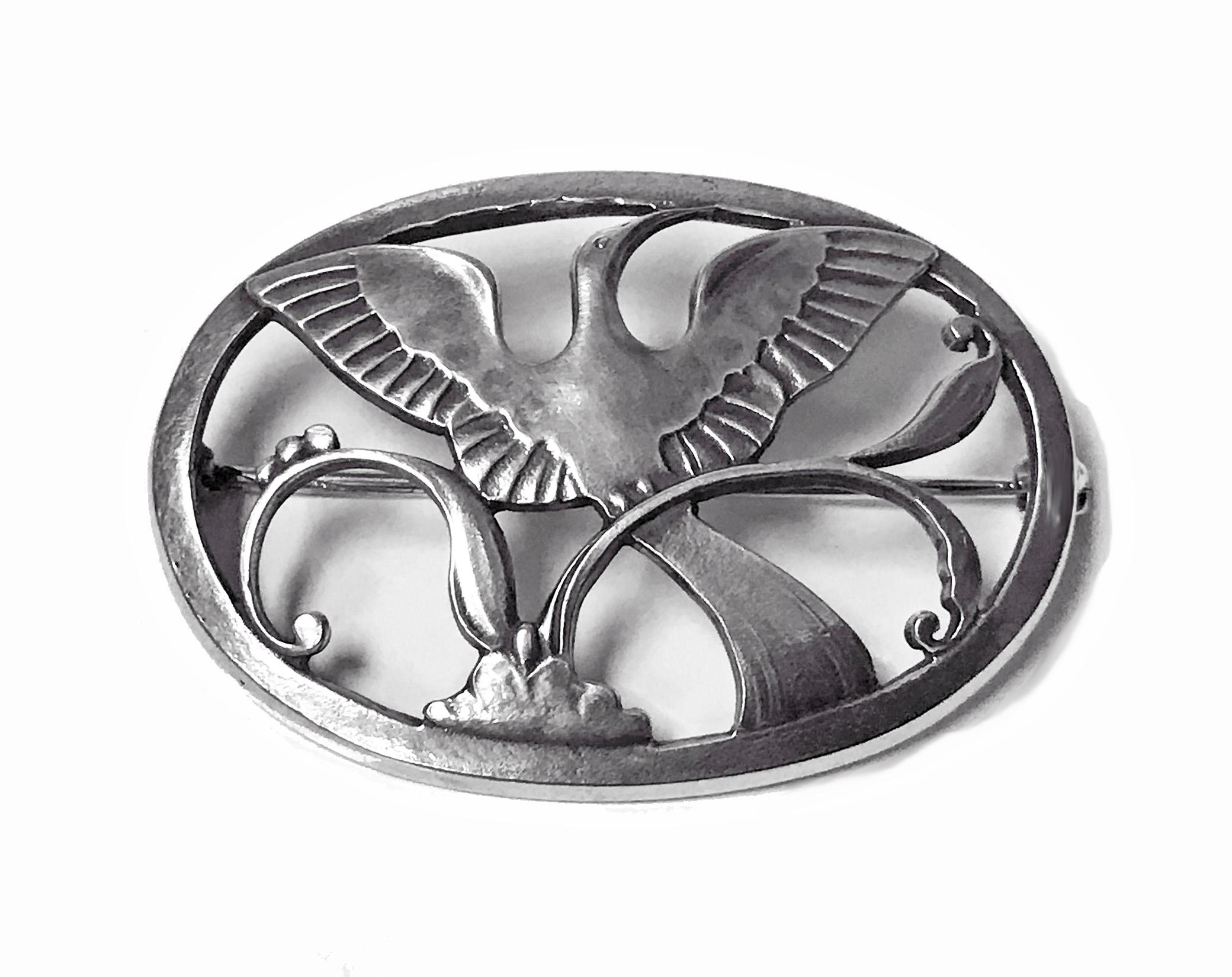 Georg Jensen Sterling Silver Paradise Bird Brooch. Fully hallmarked Georg Jensen oval dotted punch, 925 Sterling Denmark and design number 238. Designed by Arno Malinowski for Georg Jensen. Measures: 4.25 x 3.00 cm.  Weight 10.20 gm.