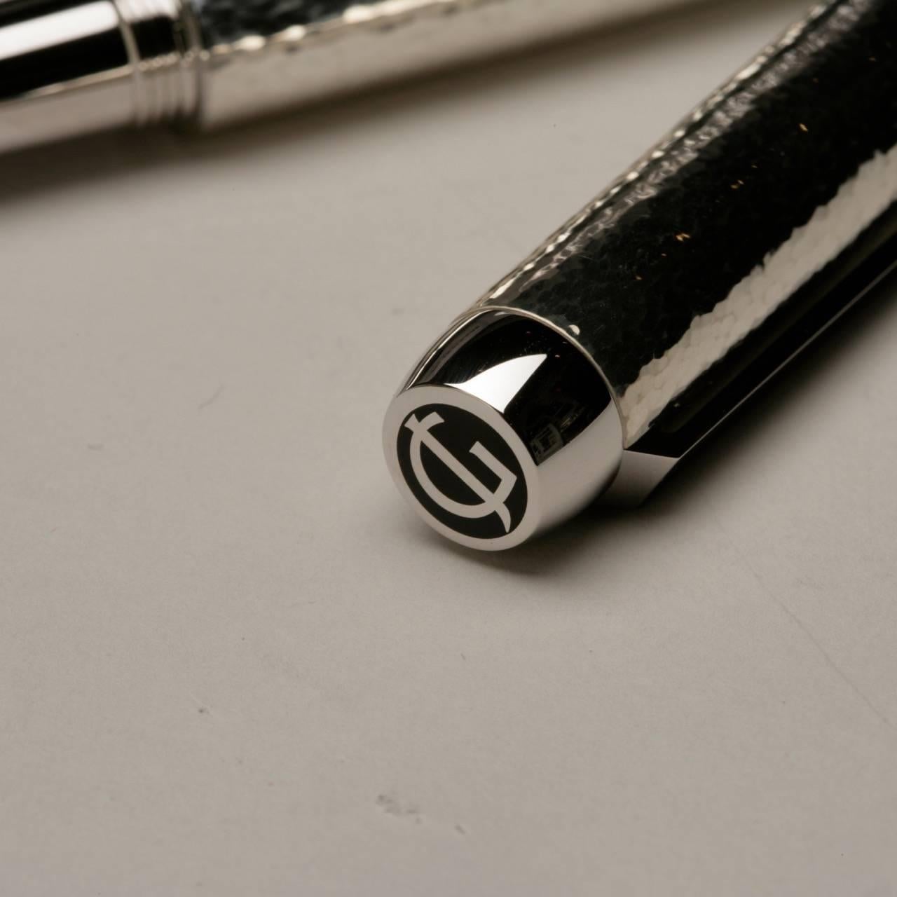 Georg Jensen sterling silver pen

Stylish and chic hammered sterling silver pen with steel nib (made in Germany.) End of screw top with GJ cypher.

Comes with gift box, extra ink cartridges, touch up cloth and registration certificate.

      