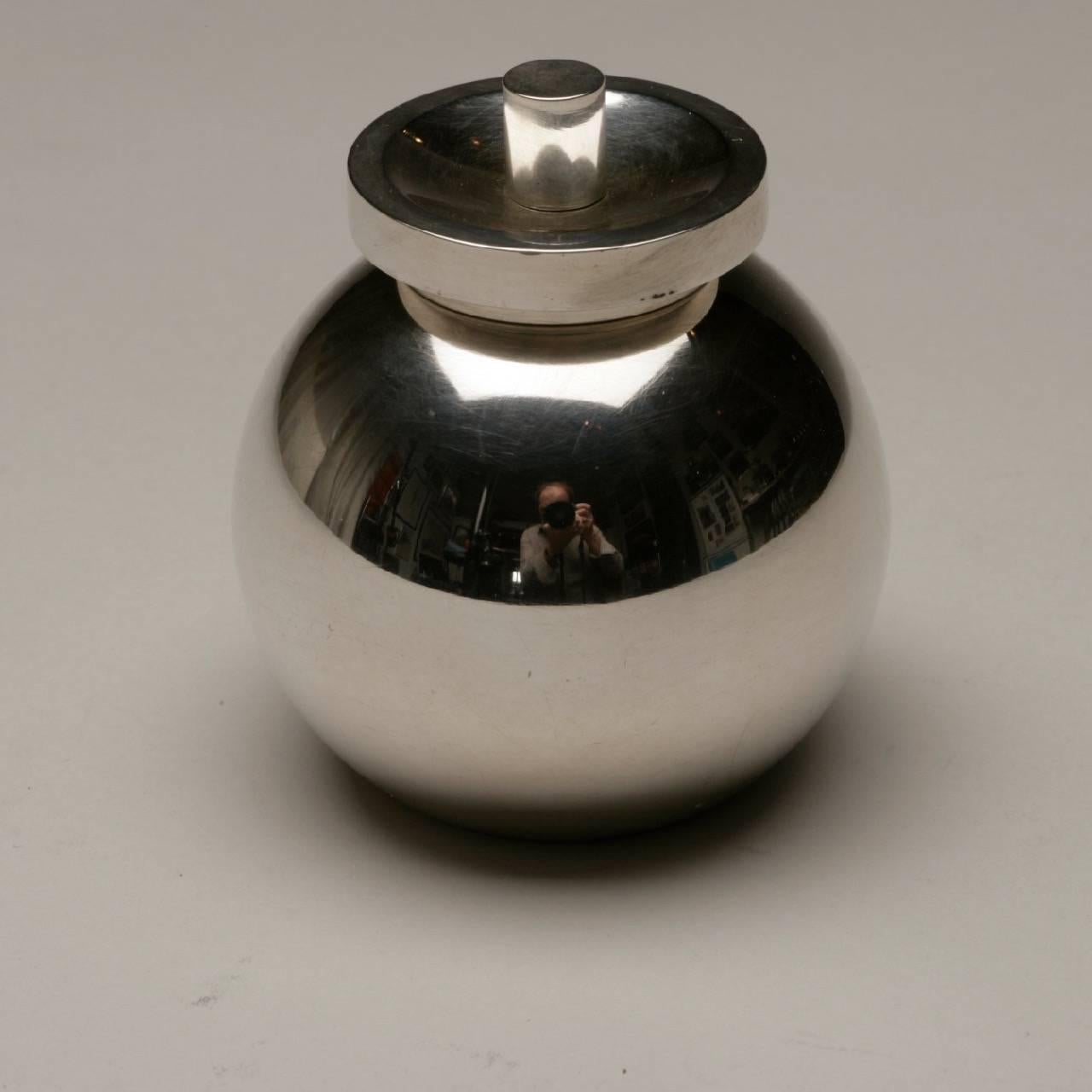 Georg Jensen sterling silver peppermill no. 1087 by Soren Georg Jensen.

 Very rare modernist design. Heavy gauge silver with a cylindrical body as well as disc top. It is in excellent working order. Mechanism made in France. Clean, inside and