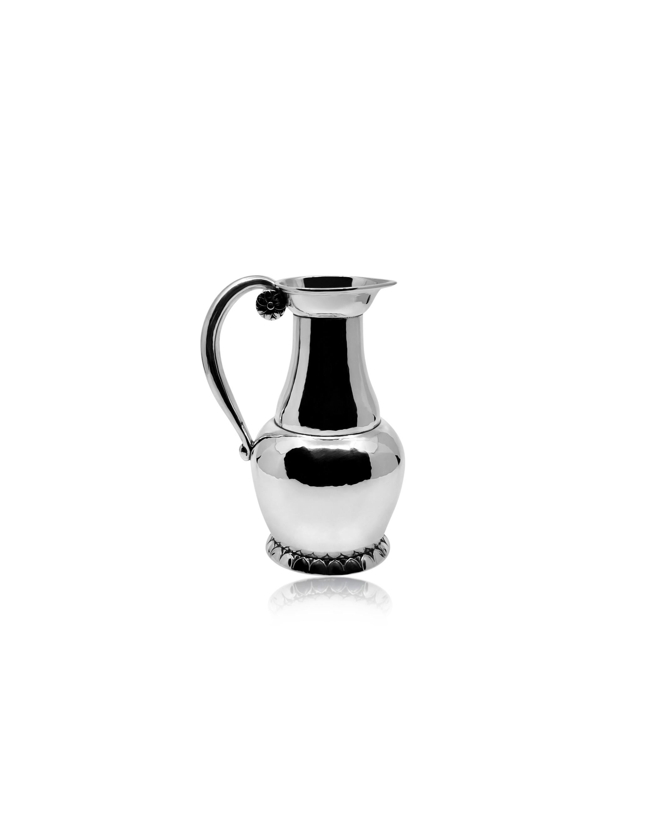 A highly uncommon Georg Jensen sterling silver pitcher, featuring design #8b by Georg Jensen dating back to around 1912. This petite jug showcases an exceptionally rare design, likely intended as a wine jug but versatile enough to serve as a water