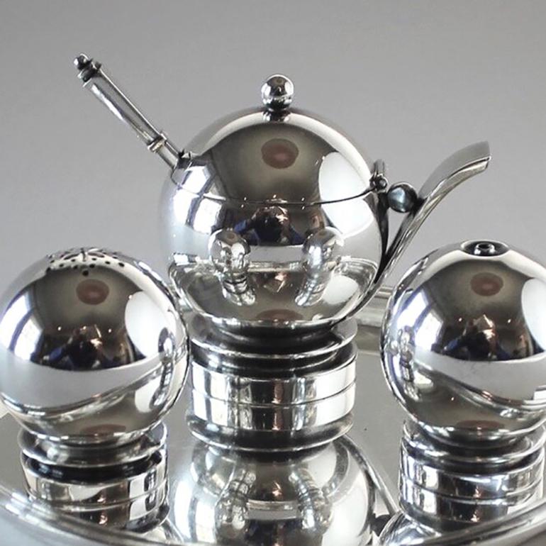 Georg Jensen sterling silver pyramid cruet set, no.632 by Harald Nielsen

Includes: 632A tray, 632 pair of shakers, 632 mustard pot with spoon

A similar example can be seen in the book Georg Jensen Holloware, the Silver Fund collection by David