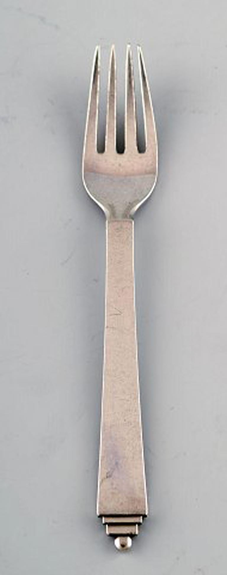 Georg Jensen sterling silver 'Pyramid' cutlery. Child's set of spoon and fork.
Spoon measures 14.5 cm.
In very good condition.
Stamped 1945-1951.
    