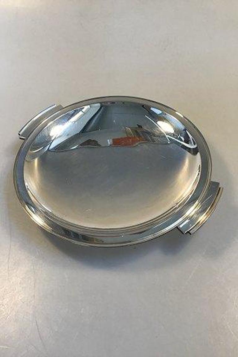 Georg Jensen sterling silver pyramid dish no 600E.

Measures: Diameter 20 cm(7.87 in) Width(by handles) 22.5 cm(8.85 in).
 